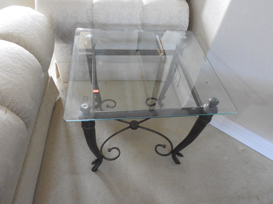 Pair of Classical Roman Style Metal & Glass End Tables: Pair of classical Roman style end tables with metal scroll bases, glass tops, and ball finial accents. Individual tables measure approx. 25 x 25 x 27 in.; listed dimensions are packed/as a set. Approx