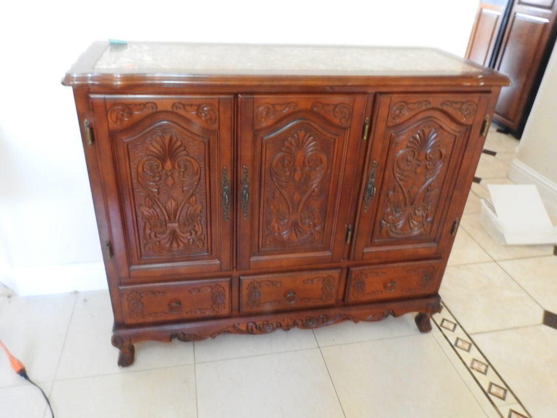 Rococo Style Breccia Pernice Marble Top Sideboard Cabinet: Rococo style mahogany sideboard cabinet with Breccia Pernice marble top, carved panels, shelved storage interior, and decorative carved detail. Approx. 39 x 46 x 18 in.