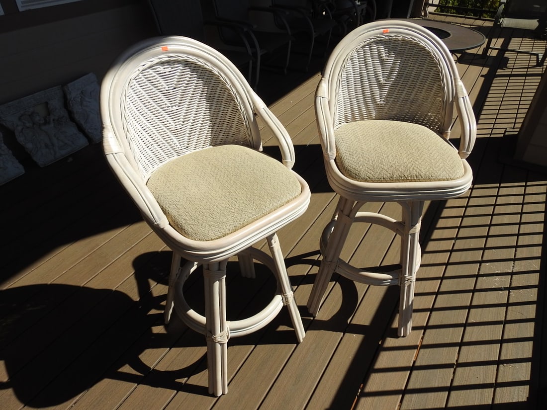 Pair of Bamboo & Rattan Bar Stools: Pair of bamboo and rattan bar stools with upholstered seats and rounded backrests. Individual stool dimensions approx. 45 x 23 x 24 in.; listed dimensions are packed/as a pair. Approx. 45 x 46 x 24