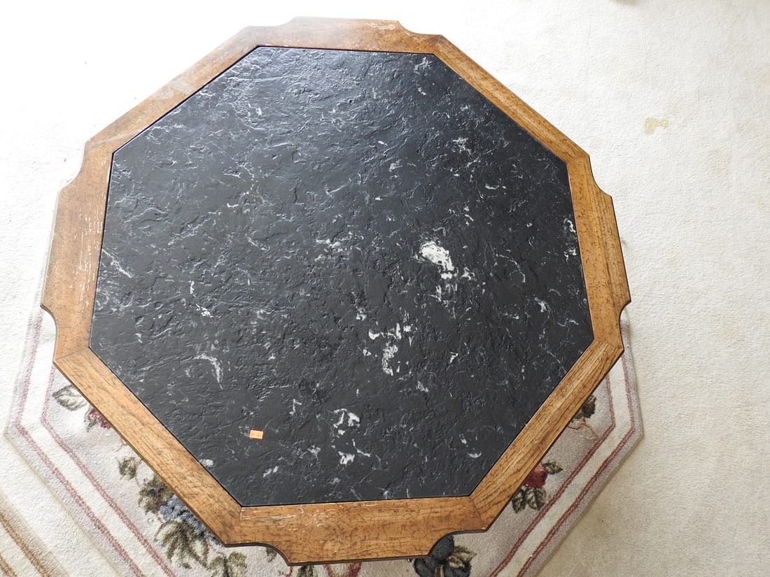 Vintage Octagonal Marble Top Coffee Table: Vintage octagonal coffee table with marble top, wood frame, and brass lion head fixtures/accents. Approx. 17 x 43 x 43 in.
