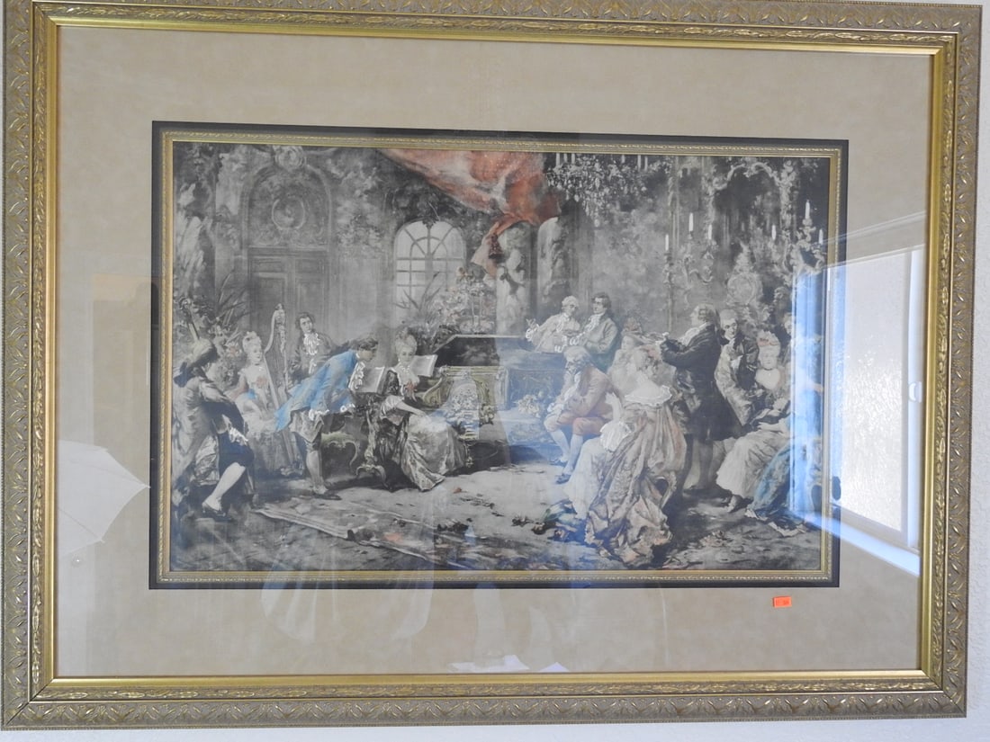 Mozart at the Court of Marie Antoinette Framed Reprint: Large framed reprint depicting Mozart at the Court of Marie Antoinette, presented under glass with decorative mat and gilt frame. Approx. 34 x 45 x 2 in.