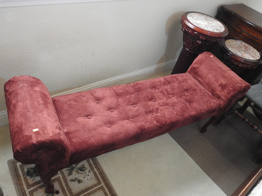Rococo Style Burgundy Tufted Settee Bench: Rococo style faux suede / velvet-look tufted settee bench with rolled arms, upholstered seat, and decorative form. Approx. 24 x 60 x 17 in.