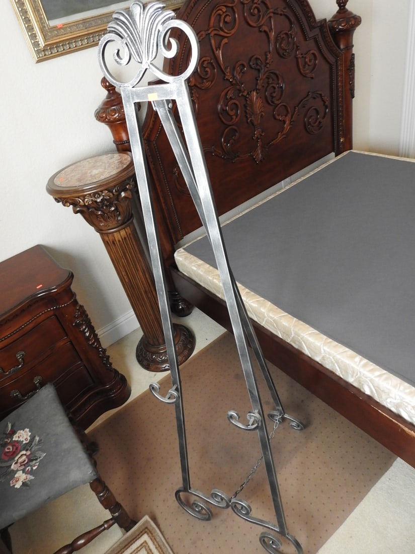 Classical Style Metal Easel: Classical style metal display easel with scrollwork and decorative tripod form. Approx. 62 x 20 x 22 in.