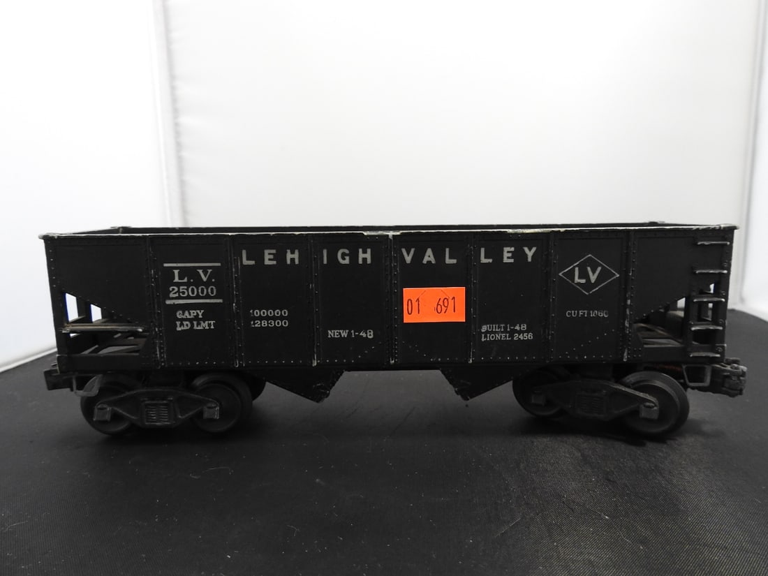 Lionel No. 2456 Lehigh Valley Hopper Car: Lionel postwar-era O gauge No. 2456 Lehigh Valley hopper car with black body, white road lettering, metal frame, and operating couplers. Circa late 1940s to 1950s Lionel production. Approx. 3.5 x 10 x
