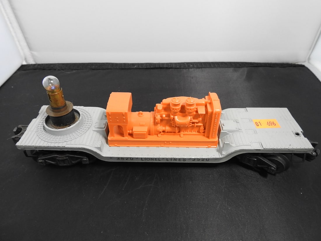 Lionel No. 3520 Rotating Searchlight Car: Lionel postwar-era O gauge No. 3520 rotating searchlight car with orange and silver searchlight assembly on flatcar base, metal frame, and plastic components. Circa 1950s Lionel production; light/rota