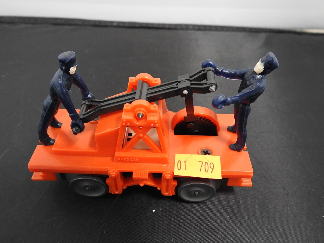 Lionel No. 6-18401 Operating Workmen Hand Car: Lionel modern-era O gauge No. 6-18401 operating workmen hand car with orange frame and worker figures. Late 20th-century Lionel production; operating feature not fully tested unless noted. Approx. 3