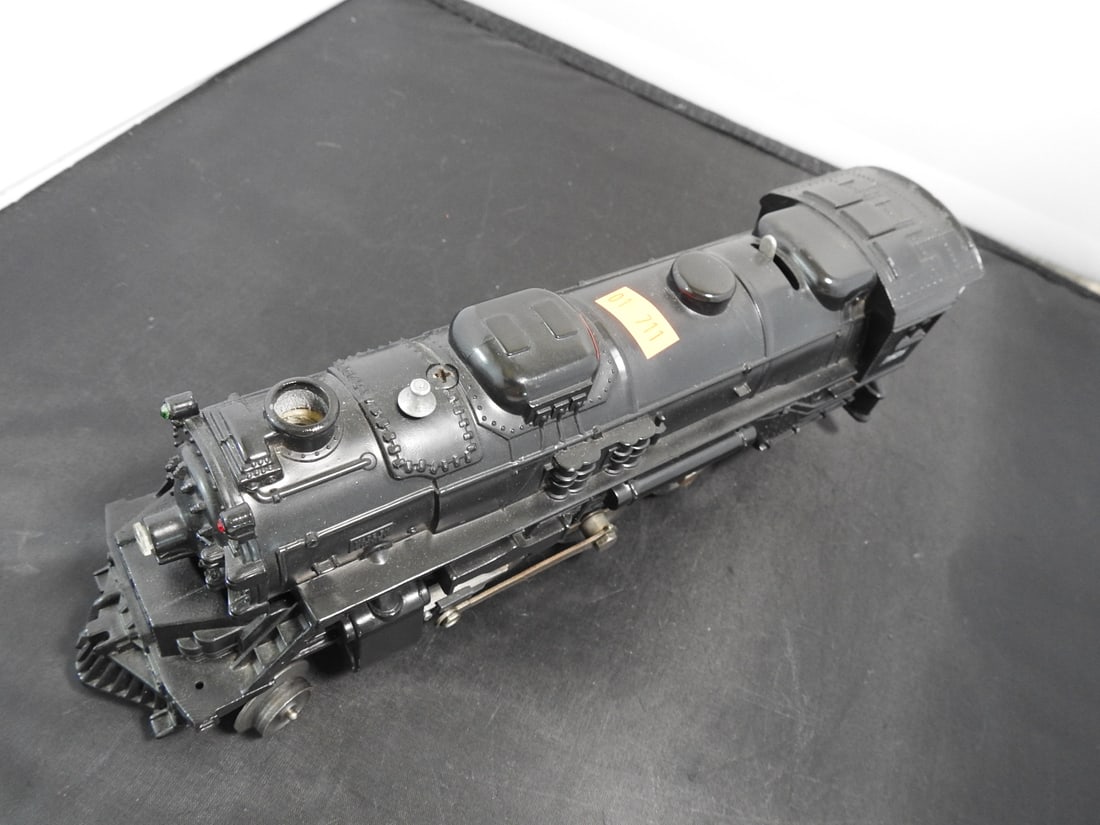Lionel No. 2026 Steam Locomotive: Lionel postwar-era O gauge No. 2026 black steam locomotive with cab number 2026, die-cast body, running gear, and operating coupler. Circa 1940s to 1950s Lionel production; operation not fully tested