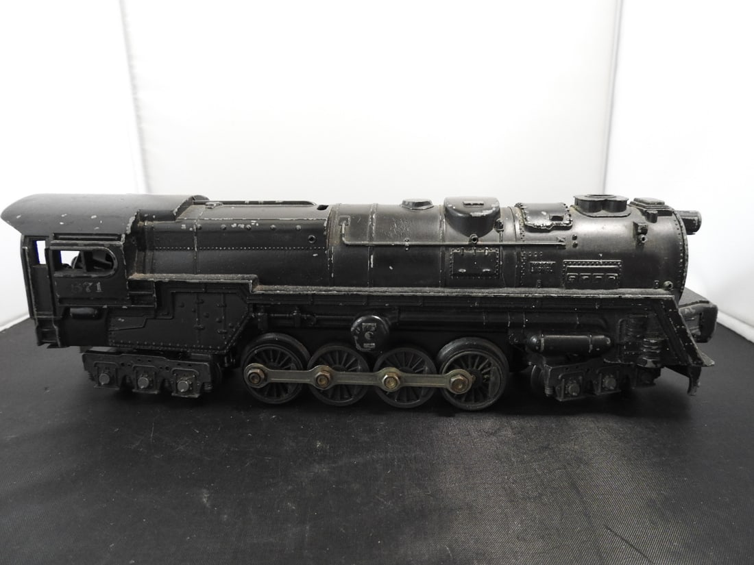 Lionel No. 671 S-2 Turbine Steam Locomotive: Lionel postwar-era O gauge No. 671 S-2 turbine steam locomotive with black die-cast body, running gear, and PRR-style turbine form. Circa late 1940s to 1950s Lionel production; operation not fully