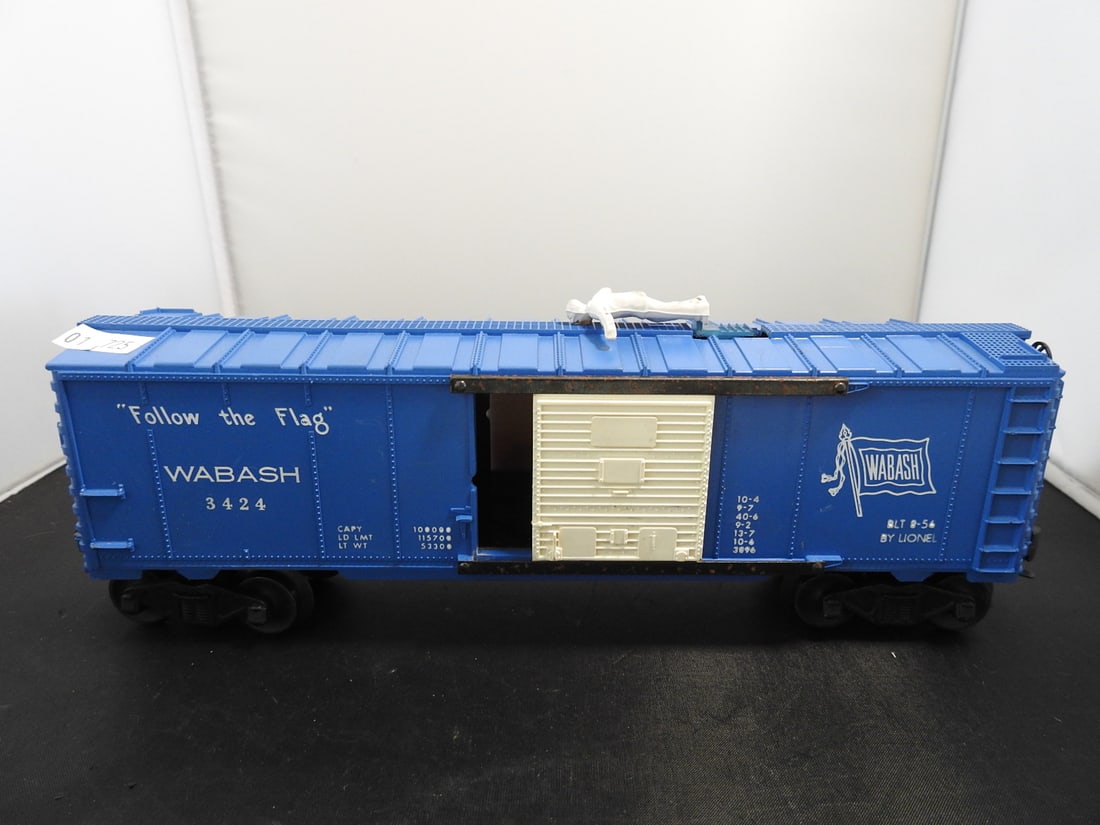 Lionel No. 3424 Wabash Operating Brakeman Boxcar: Lionel O gauge No. 3424 Wabash 'Follow the Flag' operating brakeman boxcar with blue body, white sliding door, Wabash flag logo, roof figure, and interior mechanism. Side lettering includes BLT 8-54
