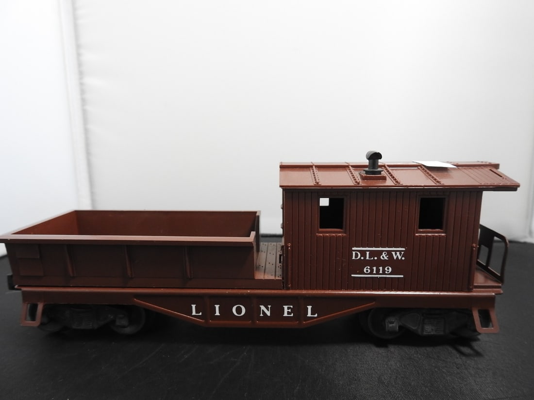 Lionel No. 6462 New York Central Gondola Car: Lionel O gauge No. 6462 New York Central gondola car with black body, white NYC markings, open top, black trucks, and operating couplers. Postwar-era, 1950s-style Lionel freight car. Approx. 2.5 x