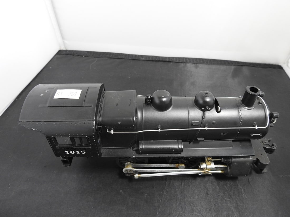 Lionel No. 1615 Steam Locomotive: Lionel O gauge No. 1615 black steam locomotive with cab number 1615, running gear, boiler detail, and metal/plastic construction. Postwar-era, 1950s-style Lionel steam locomotive; operation not fully