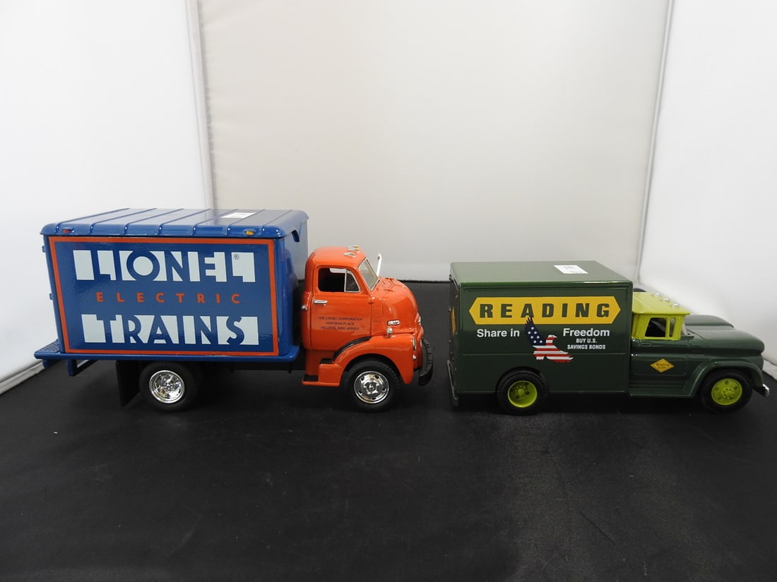 Lot of Two Die-Cast Railroad Advertising Delivery Trucks: Lot of two die-cast railroad advertising trucks including a Lionel Electric Trains box truck and a green Reading 'Share in Freedom' delivery truck. Late 20th to early 21st-century collectible die-cast