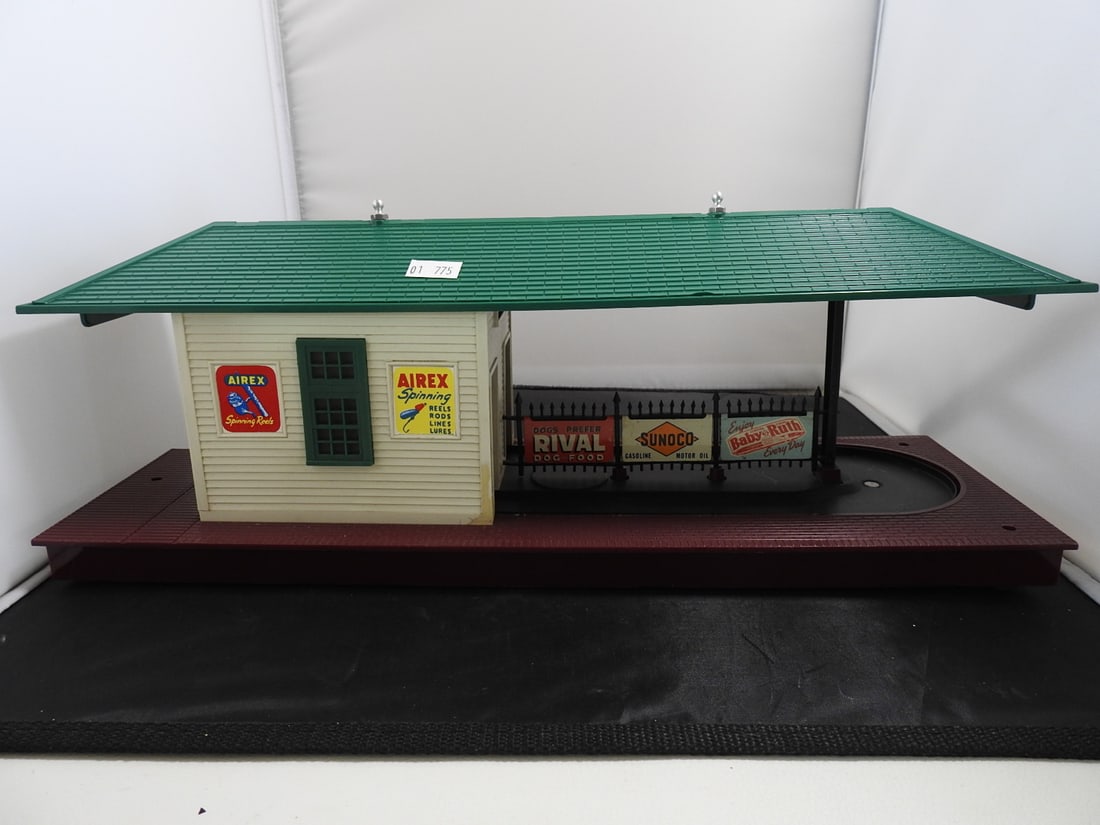 Lionel No. 356 Automatic Freight Station with Accessory Parts: Lionel No. 356 Automatic Freight Station with Lionelville station/freight platform pieces and assorted Lionel accessory parts, bulbs, wiring, shock pellets, and related small components. Marked The