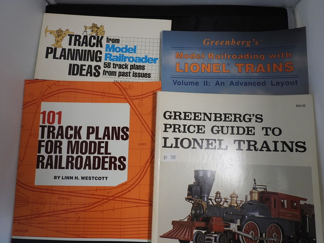 Lionel Train Track Planning and Reference Book Lot: Lot of Lionel and model railroading reference books, including track planning guides, layout idea books, and Greenberg Lionel train guide material. Mixed late 20th century reference lot, measured as