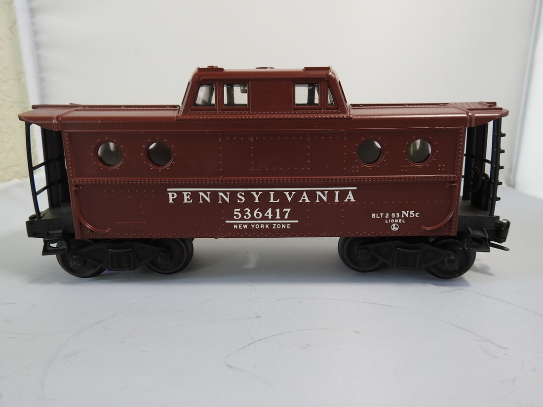 Lionel Train Car with Metal and Plastic Body: Lionel train car with metal and plastic body construction. Vintage Lionel train car, measured as packed. Approx. 3.75 x 8.75 x 2.75 in.