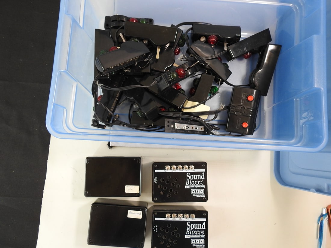 Sound Blox Model Railroad Sound Units and Control Parts Lot: Lot of Sound Blox model railroad sound modules and control parts by QSI, with labeled units including station, commuter, rail yard, steam yard, and other sound/control components. Late 20th century /