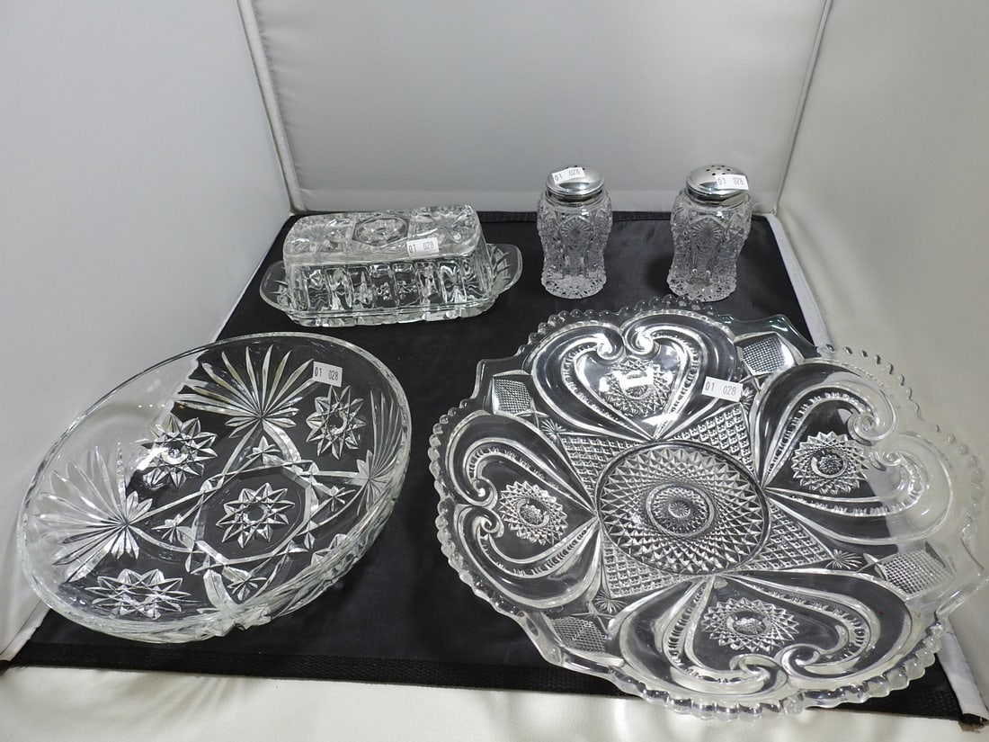 Pressed and Cut Glass Serving Items, 5 Pieces: 5-piece pressed and cut glass serving lot with assorted bowls, trays, butter dish, and salt/pepper shakers. Measured as packed. Approx. 5 x 10 x 10 in.