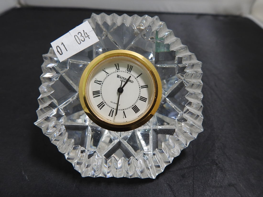 Waterford Crystal Desk Clock with Extra Battery: Vintage Waterford crystal desk clock with round clock face set into faceted crystal body. Extra battery included. Approx. 3 x 4 x 3 in.
