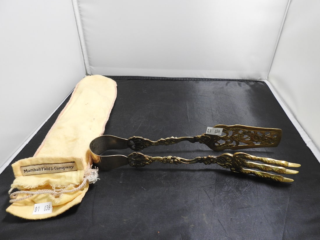 Antique Brass Hand-Form Meat Tongs: Antique brass meat tongs with hand-form ends and decorative elongated handle. Approx. 12 x 2 x 2 in.