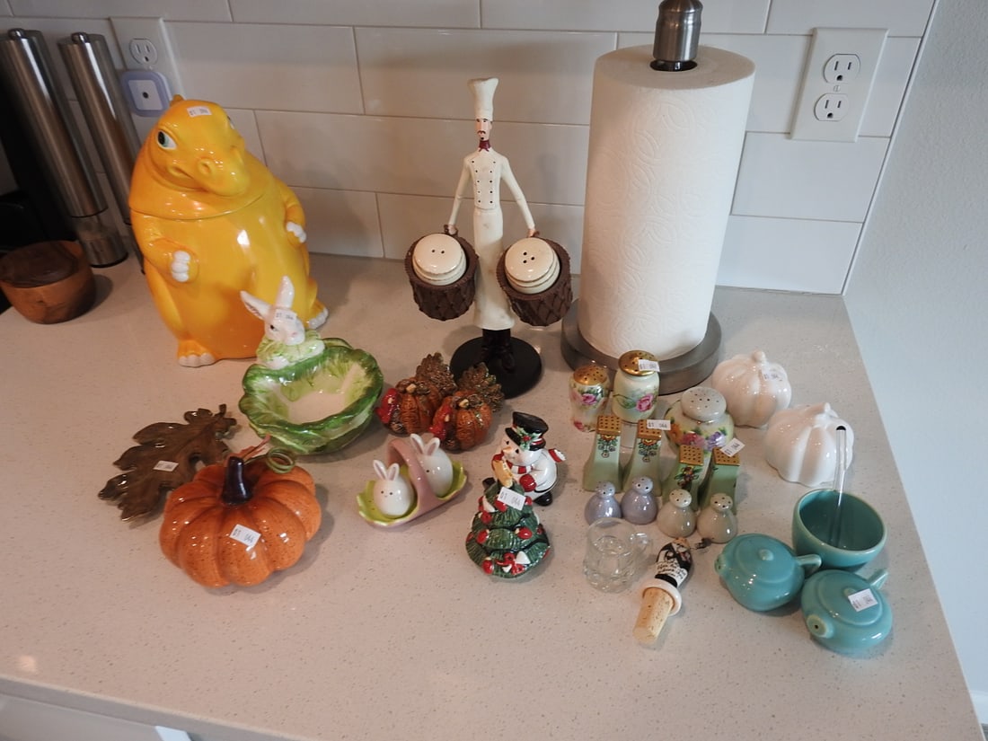 Vintage Salt & Pepper Shakers and Seasonal Decor Collection: Collection of vintage salt and pepper shakers and seasonal decorative items with assorted ceramic, glass, and novelty pieces. Measured as packed. Approx. 22 x 20 x 28 in.
