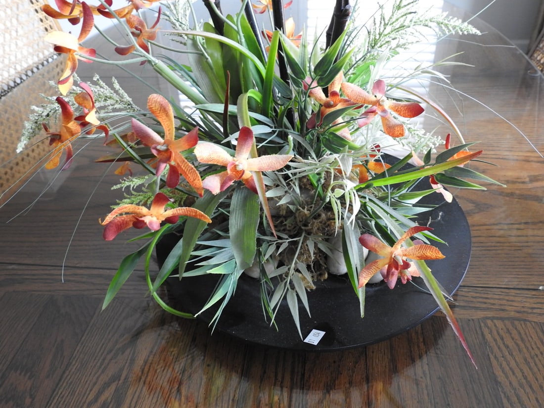 Large Artistic Silk Floral Arrangement: Large artistic silk floral arrangement with tall stems and orange floral accents. Approx. 36 x 12 x 12 in.