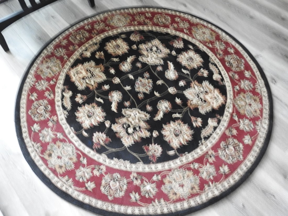 Classic Round Area Rug: Classic round area rug with floral medallion design and red, black, and beige tones. Approx. 0.5 x 70 x 70 in.