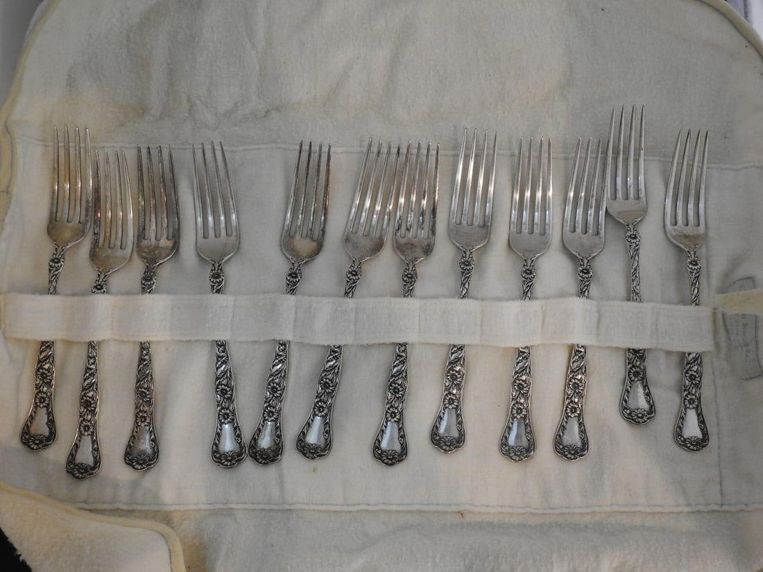 12-Piece Gorham Marguerite Sterling Silver Fork Set: Set of 12 sterling silver forks in the Marguerite pattern by Gorham Silver. total weight at 427.38 grams / 15.07 troy oz. Approx. 3.5 x 8.5 x 4 in.