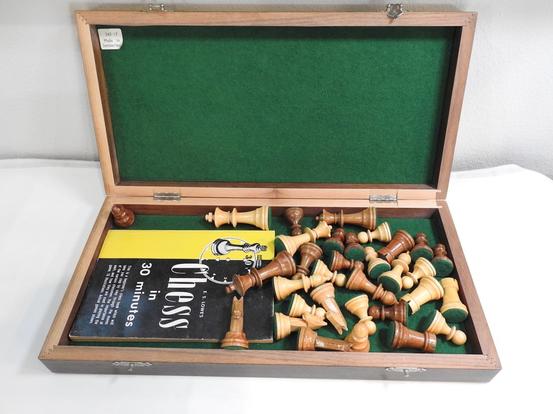Vintage Swiss Wood Chess Set with Original Manual: Vintage wood chess set made in Switzerland with original manual included. Approx. 2.5 x 15.5 x 8 in.