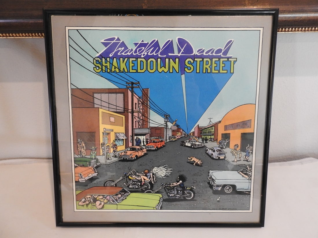 Framed Grateful Dead Shakedown Street Album Display: Framed Grateful Dead Shakedown Street album display, presented under frame for wall display. Approx. 13 x 13 x 1 in.