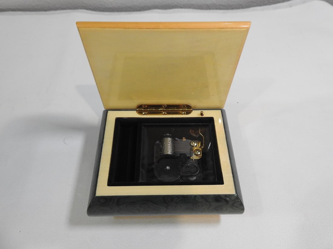 Italian Inlaid Wood Music Box: Italian inlaid wood music box, made in Italy; noted as working and plays. Approx. 3 x 5 x 4 in.