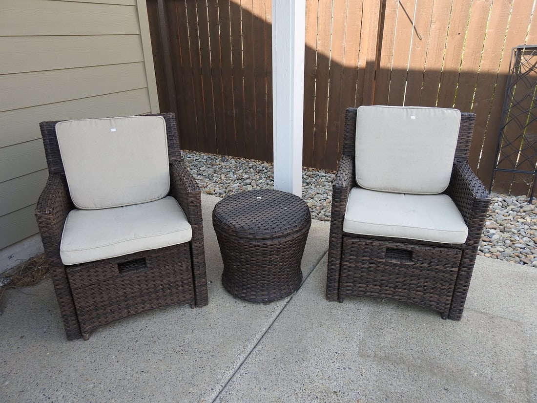 Outdoor Plastic Rattan Patio Chair Set with Side Table: Outdoor patio seating set with two plastic rattan/wicker-look armchairs, beige seat cushions, and matching round side table. Each chair measures approx. 34 x 25.5 x 25.5 in.; table measures approx.
