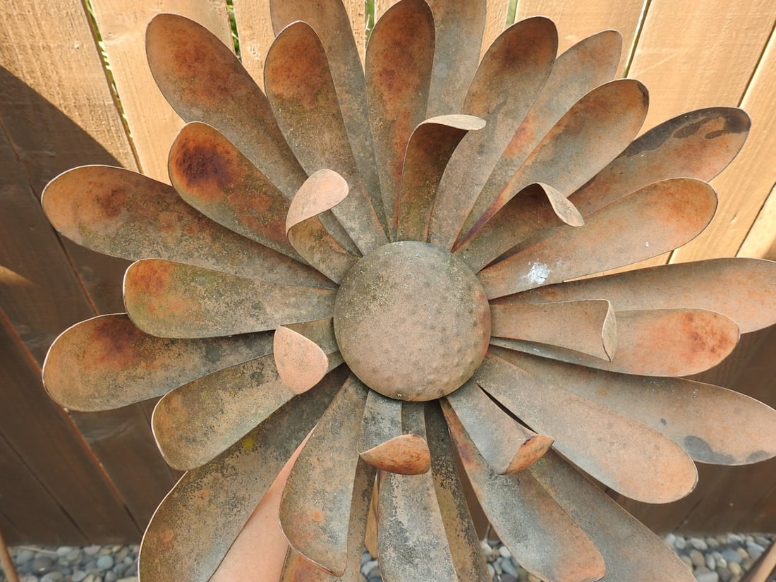 Large Metal Garden Flower Stake Sculpture: Large decorative metal garden flower stake sculpture with layered petal design and weathered outdoor finish. Approx. 33.5 x 13.5 x 13.5 in.