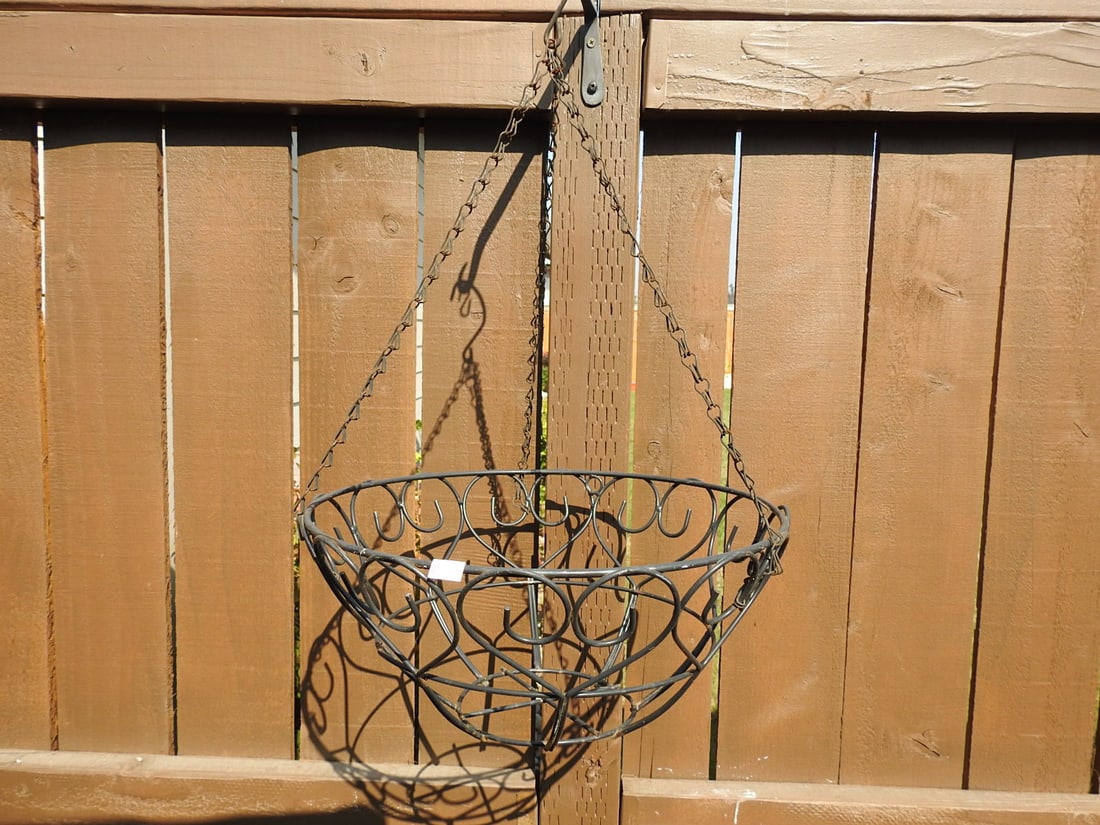 Hanging Metal Garden Basket Planter: Hanging metal garden basket planter with wire scrollwork bowl form and chain hanger. Approx. 7 x 14.5 x 14.5 in.