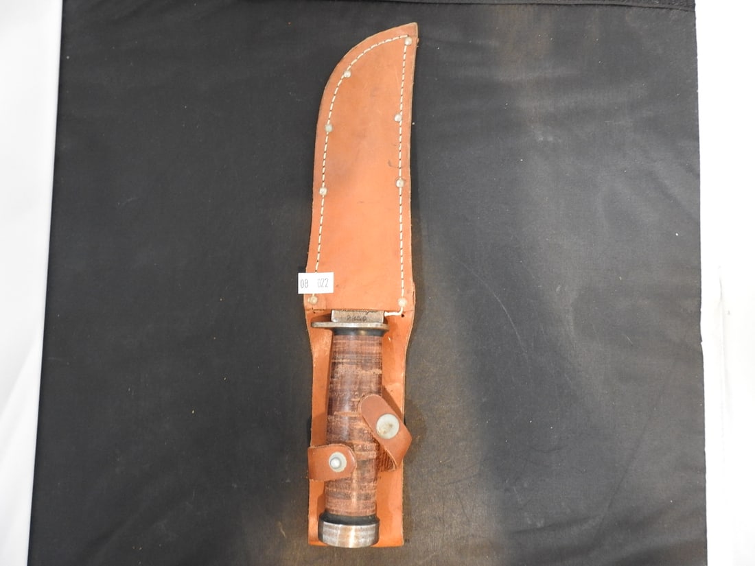 Vintage Cattaraugus Knife: Vintage Cattaraugus knife with leather sheath, measured as packed. Approx. 2 x 12 x 2.75 in.