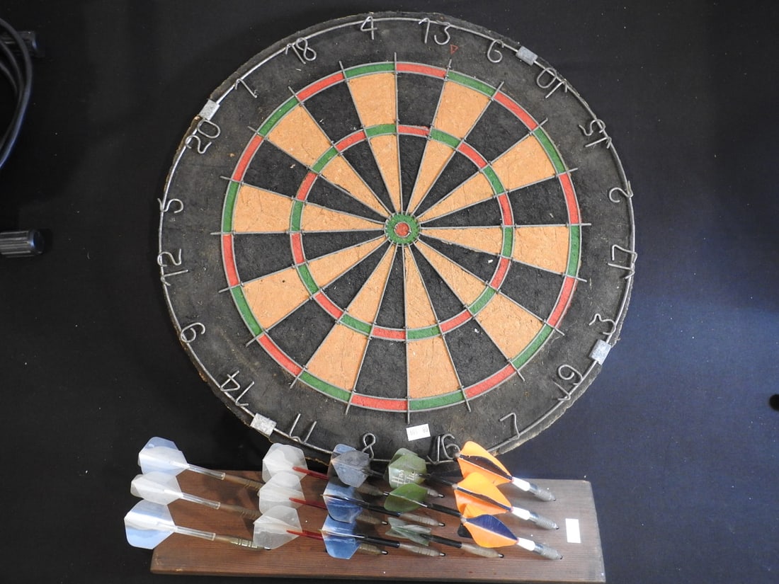 Vintage Corkboard Darts Game Made in England: Vintage corkboard darts game made in England with dart accessories as shown, measured as packed. Approx. 9 x 19 x 19 in.