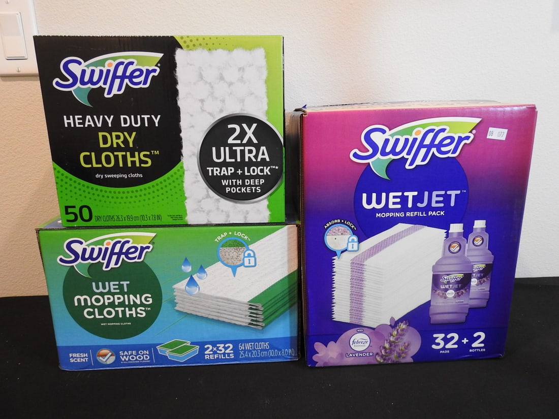Swiffer WetJet and Sweeper Refill Lot: Swiffer WetJet and Sweeper refill lot including heavy duty cloths and multi-surface pads, measured as packed. Approx. 16.5 x 16.5 x 11 in.