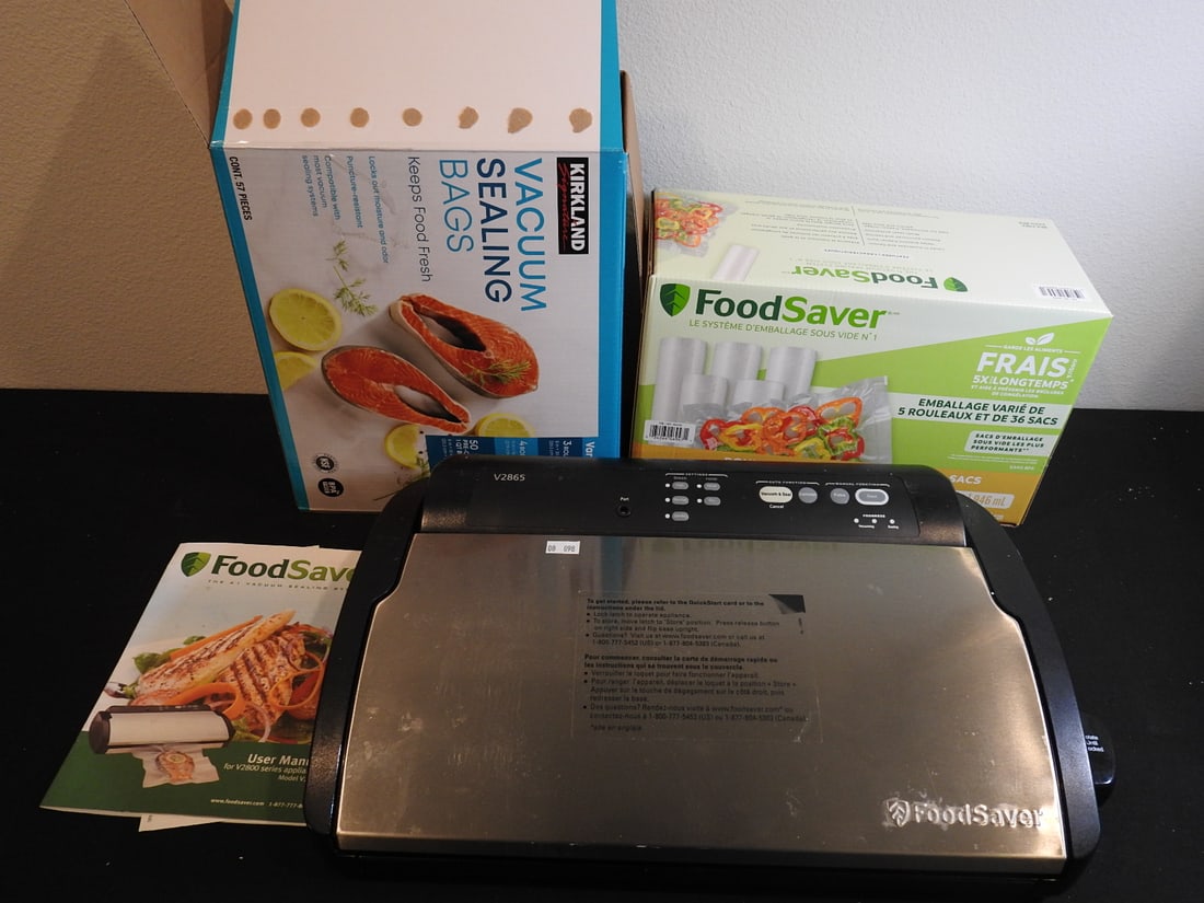 FoodSaver Vacuum Sealer with Supplies: FoodSaver vacuum sealer with supplies including roll/bag materials as shown, measured as packed. Approx. 8 x 14 x 17 in.