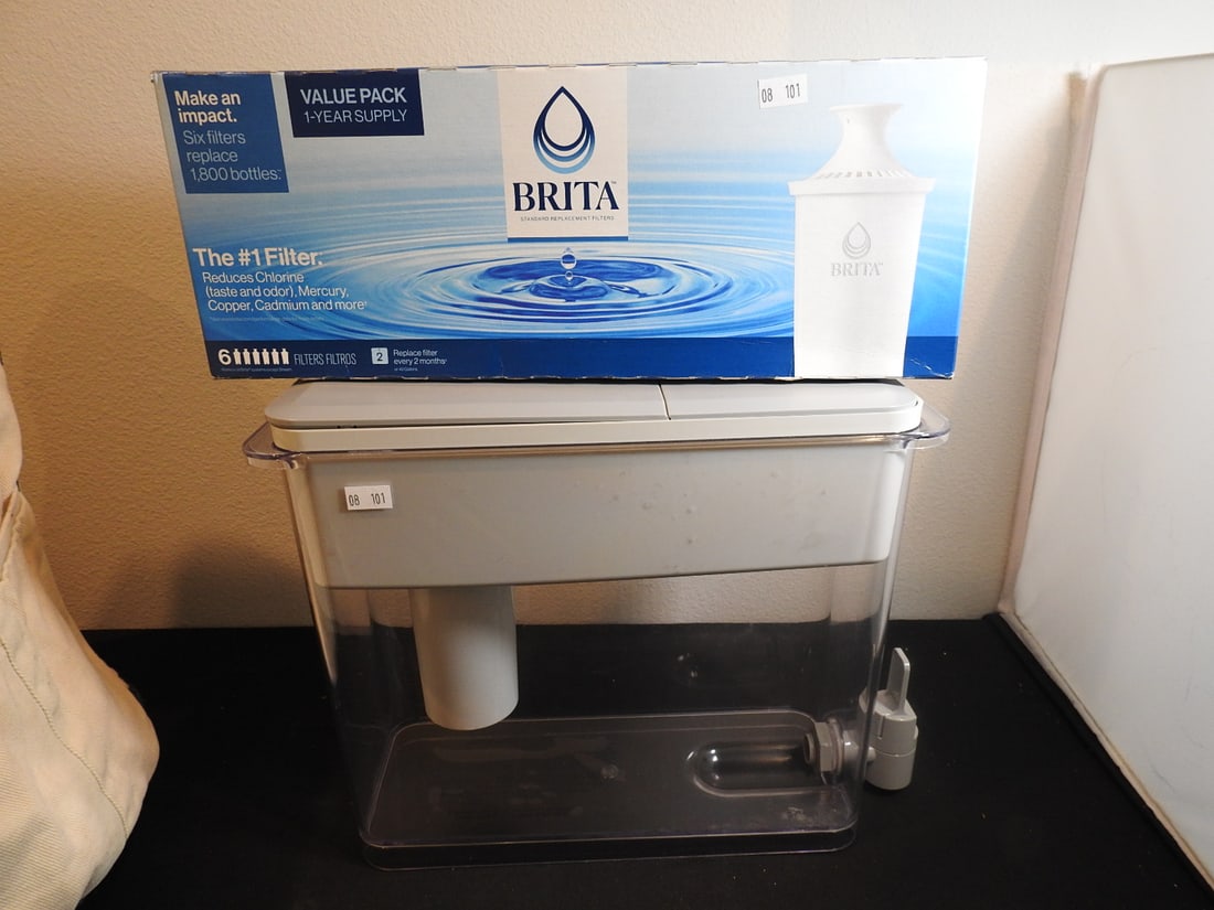 Brita Water Dispenser with Filters: Brita water dispenser with two filters as shown, measured as packed. Approx. 11 x 13 x 5 in.