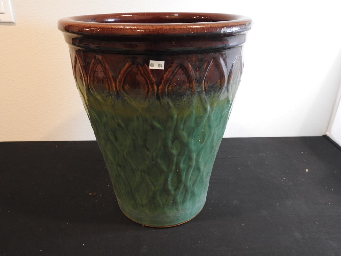 Textured Ceramic Planter: Textured ceramic planter with green and reddish glazed finish, measured as packed. Approx. 16 x 14 x 14 in.