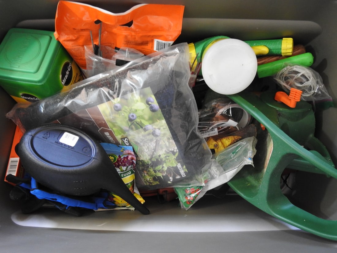 Garden Supplies Lot: Garden supplies lot including watering can, sprayers, plant food, and related garden accessories, measured as packed. Approx. 16 x 19 x 33 in.