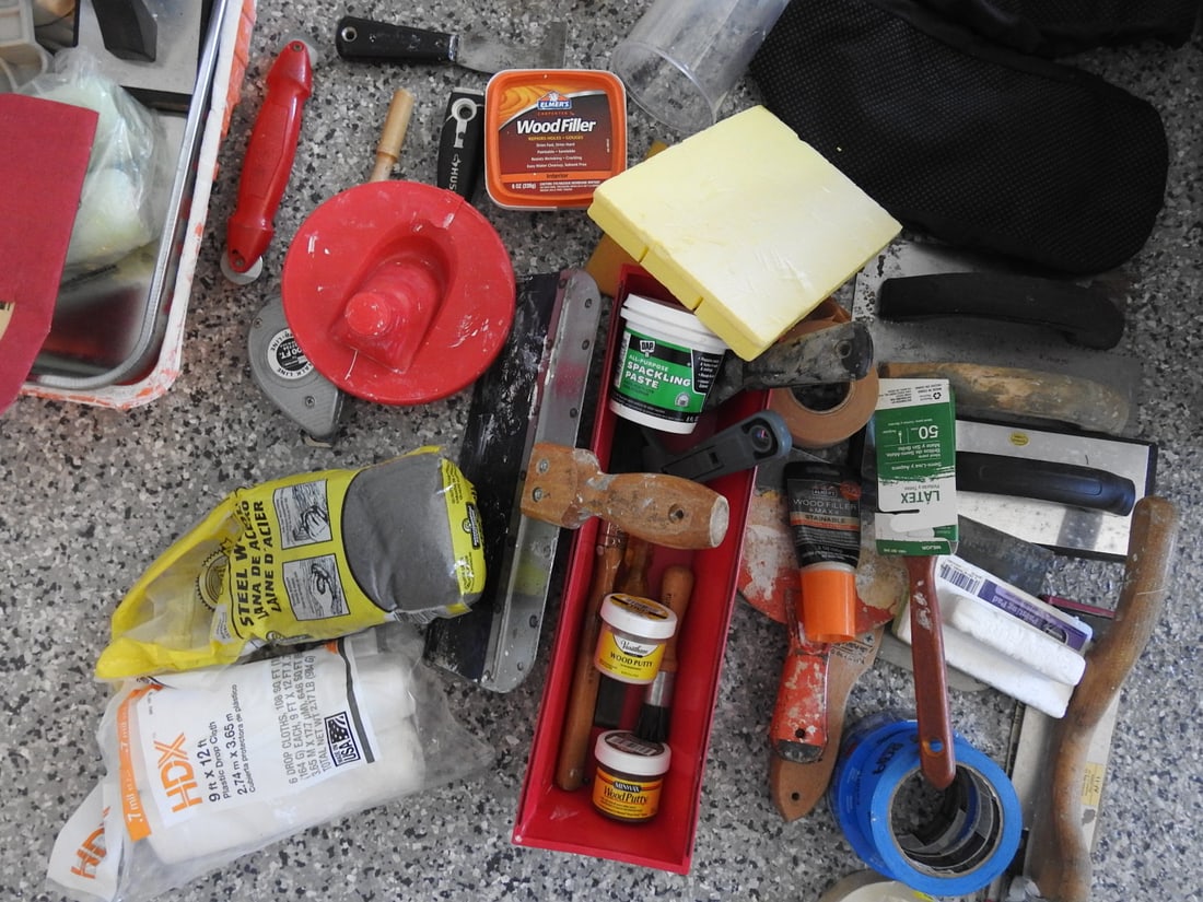 Interior Paint Supplies Lot: Interior paint supplies lot including paint, spackle, tape, tools, and related supplies, measured as packed. Approx. 18 x 14 x 26 in.