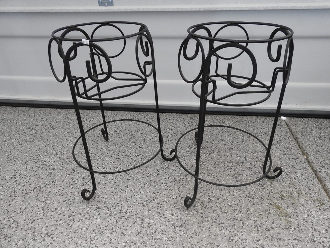 Pair of Black Metal Plant Stands: Pair of black metal plant stands, measured as packed. Approx. 23 x 21 x 21 in.