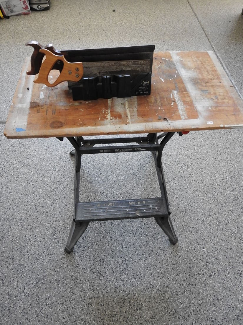 Adjustable Workbench: Adjustable workbench with wooden top and metal frame, measured as packed. Approx. 31 x 34 x 20 in.