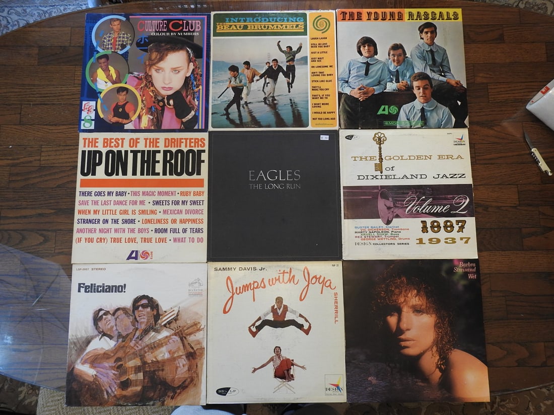Lot of Nine Assorted Vinyl Records: Lot of nine assorted vinyl records, one photo per lot as noted. Visible records include mixed rock, pop, country, jazz, and easy listening titles. Approx. 2 x 13 x 13 in.