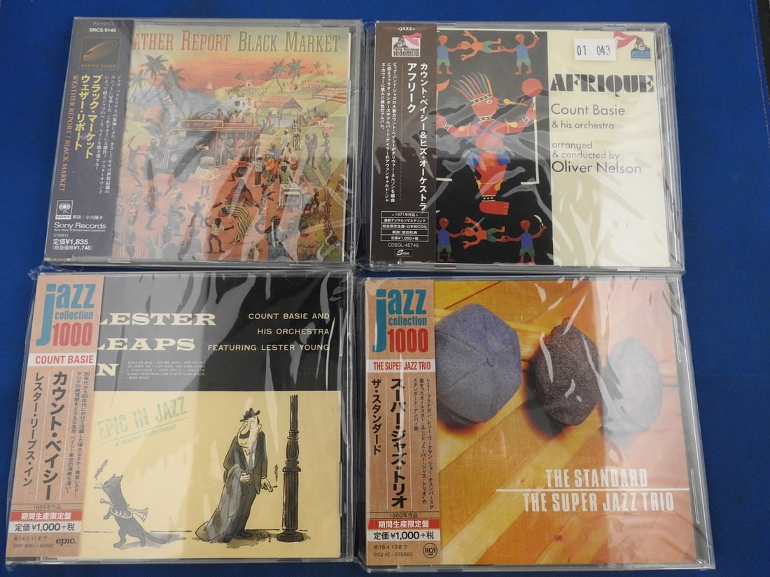 Japanese Import Jazz CD Lot of 4 - Weather Report, Count Basie & Super Jazz Trio: Lot of four Japanese issue/import jazz CDs with obi strips as photographed. Includes Weather Report Black Market; Count Basie & His Orchestra Afrique arranged and conducted by Oliver Nelson; Count Bas