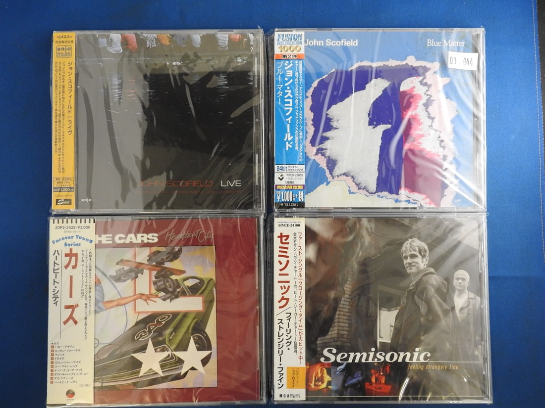 Japanese Import CD Lot of 4 - John Scofield, The Cars & Semisonic: Lot of four Japanese issue/import CDs with obi strips as photographed. Includes John Scofield Blue Matter; John Scofield Live; The Cars Heartbeat City; and Semisonic Feeling Strangely Fine.