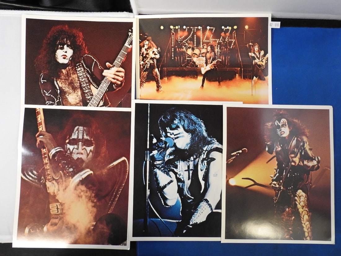 KISS Concert Photo Memorabilia Lot - 6 Prints: Lot of six KISS concert/performance photo prints featuring individual and group stage images, as photographed.