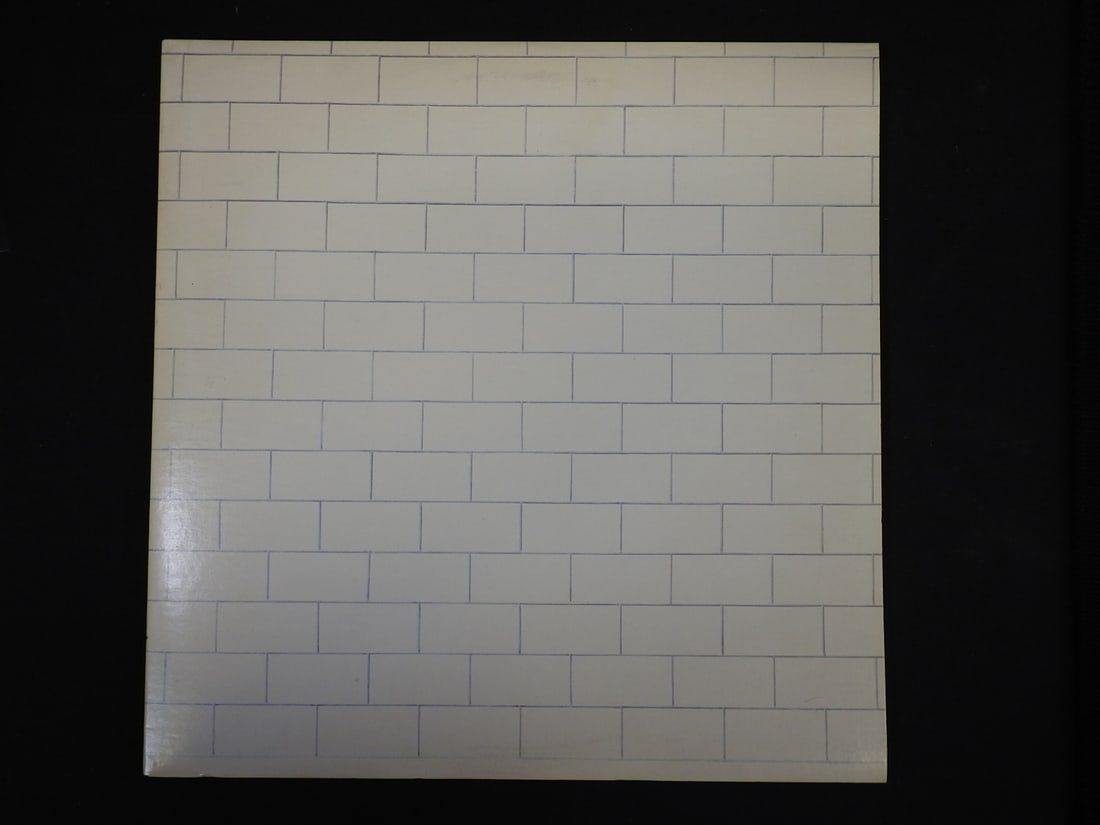 Pink Floyd The Wall Double Vinyl LP: Pink Floyd The Wall double vinyl LP set with two records, gatefold album packaging and printed inner sleeves/materials as photographed.