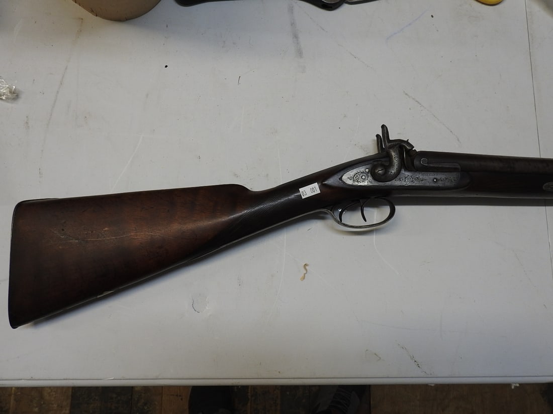 Hilyard Double-Barrel Percussion Smoothbore – London Fine Twist: Antique side-by-side percussion muzzleloading smoothbore marked “HILYARD” on the lockplate and “LONDON FINE TWIST” on the barrels/rib. Double external hammers, double triggers, wood