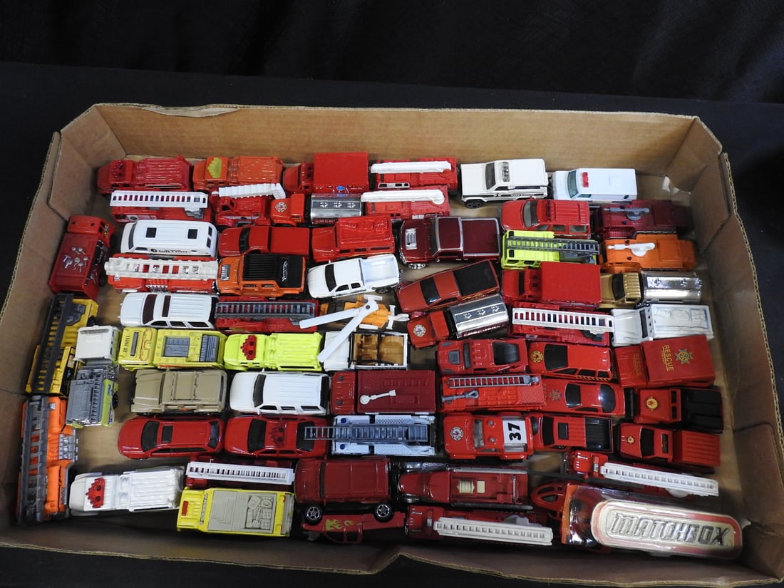 Large Assortment of Matchbox, Hot Wheels and Other Die-Cast Vehicles: Large mixed assortment of loose die-cast cars, trucks and emergency vehicles. Visible brands include Matchbox and Hot Wheels; exact count and completeness are not independently verified.
